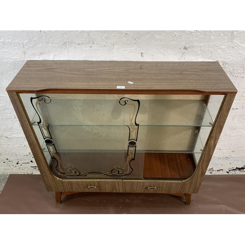 136 - A mid 20th century melamine and glass display cabinet - approx. 104cm high x 107cm wide x 30cm deep