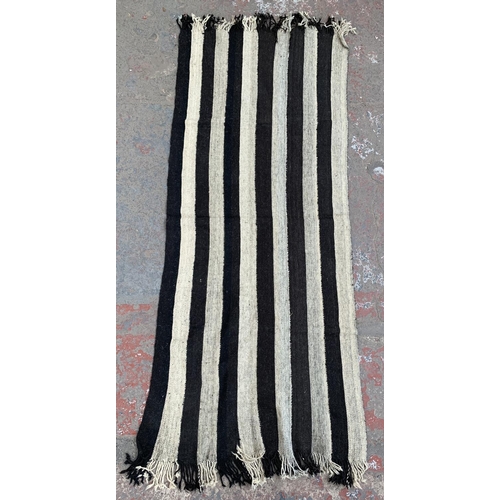 108 - A mid 20th century black and white Kilim hall runner/rug - approx. 245cm x 95cm