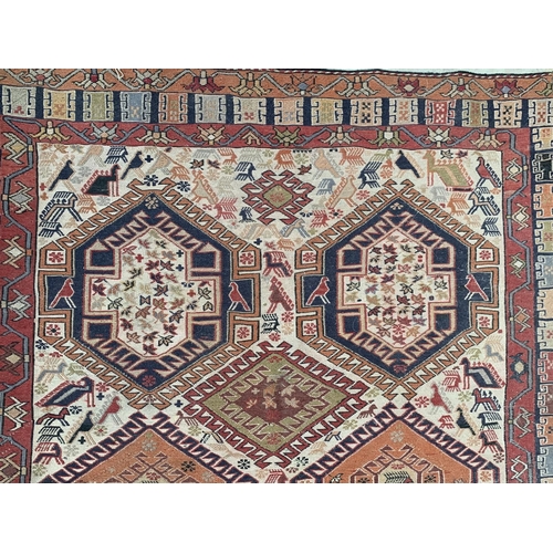 192 - An antique Persian hand knotted rug - approx. 200cm x 118cm