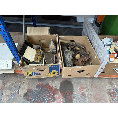 1050 - Two boxes containing antique wood planes, hand drills, chisels etc.