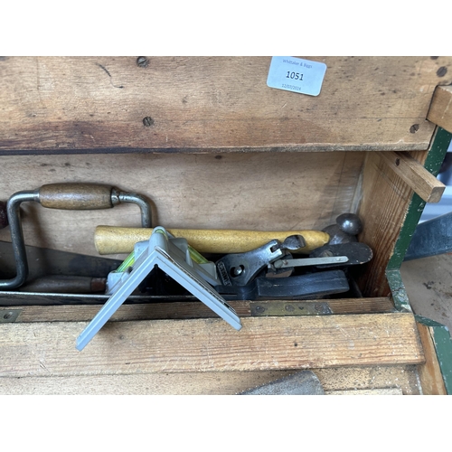 1051 - A vintage carpenter’s tool chest containing Spear & Jackson hand saws, Stanley hand drill, Record no... 