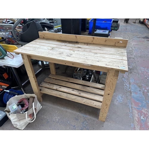 1071 - A pine workbench - approx. 121cm wide x 96cm high x 56cm deep