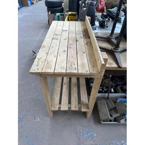 1071 - A pine workbench - approx. 121cm wide x 96cm high x 56cm deep