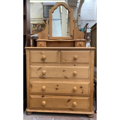 105 - A solid pine dressing chest with two short and three long drawers and upper swing mirror - approx. 1... 