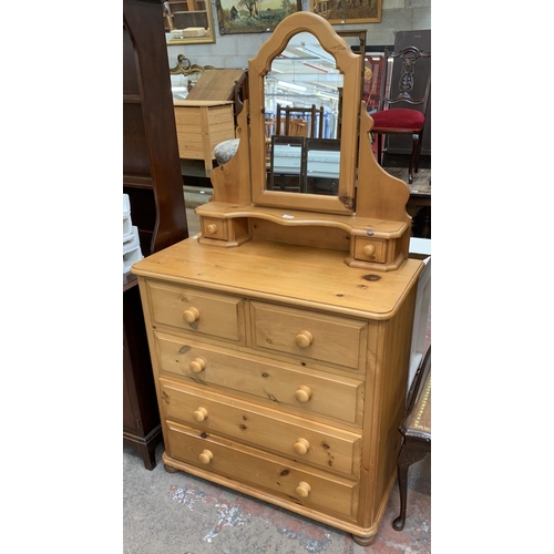 105 - A solid pine dressing chest with two short and three long drawers and upper swing mirror - approx. 1... 