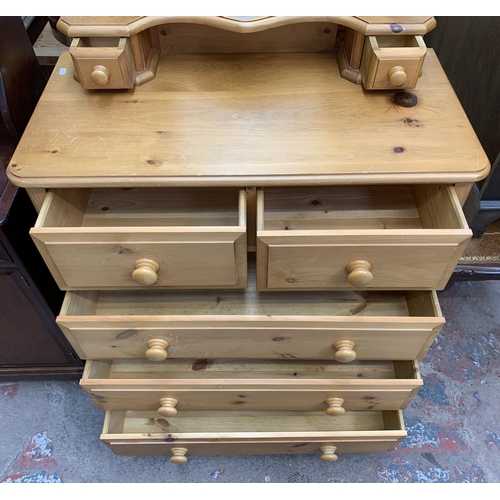 105 - A solid pine dressing chest with two short and three long drawers and upper swing mirror - approx. 1... 