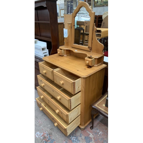 105 - A solid pine dressing chest with two short and three long drawers and upper swing mirror - approx. 1... 