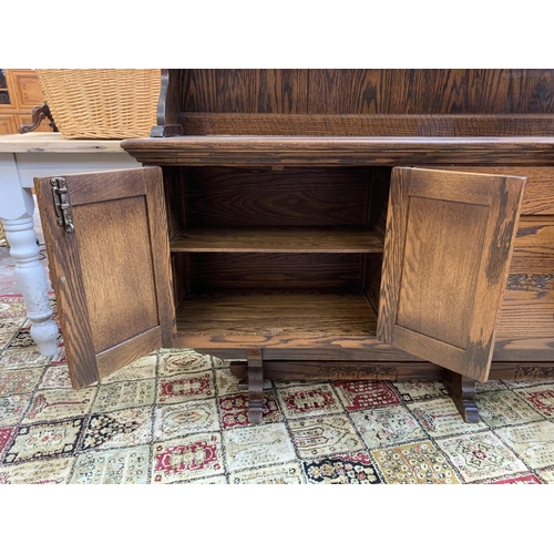 111 - A carved oak dresser - approx. 161cm high x 186cm wide x 42.5cm deep