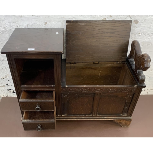 112 - A vintage oak telephone table with carved lion armrest, storage chest and two drawers - approx. 73cm... 