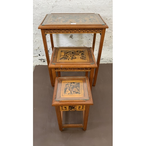 116 - Three Chinese carved hardwood side tables - largest approx. 66cm high x 50.5cm wide x 35cm deep