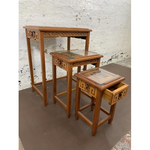 116 - Three Chinese carved hardwood side tables - largest approx. 66cm high x 50.5cm wide x 35cm deep