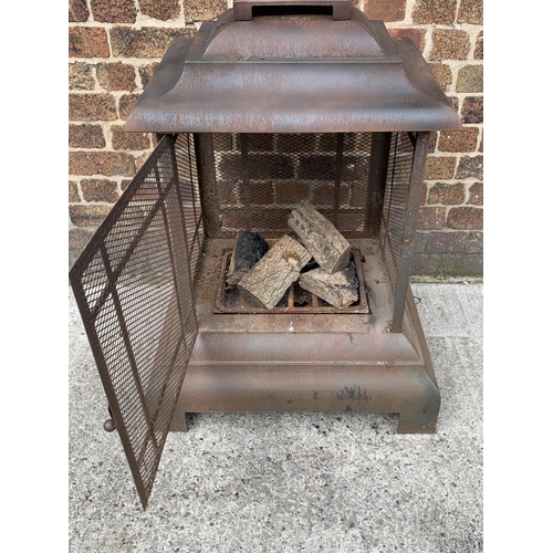 118 - An Oriental style metal garden firepit - approx. 104cm high x 71cm wide x 71cm deep