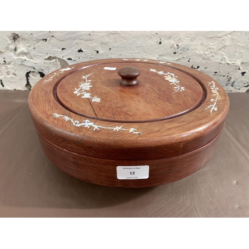 12 - A Chinese hardwood and mother of pearl inlaid lazy susan with five hand painted ceramic snack dishes... 