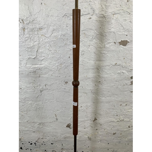 124 - A 1960s teak and brass standard lamp - approx. 143cm high