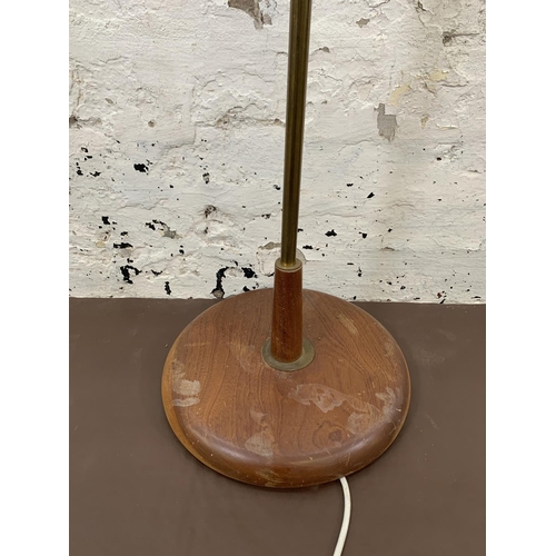 124 - A 1960s teak and brass standard lamp - approx. 143cm high