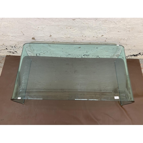 134 - A contemporary Fiam Italia thick glass rectangular coffee table - approx. 40cm high x 120cm long x 5... 