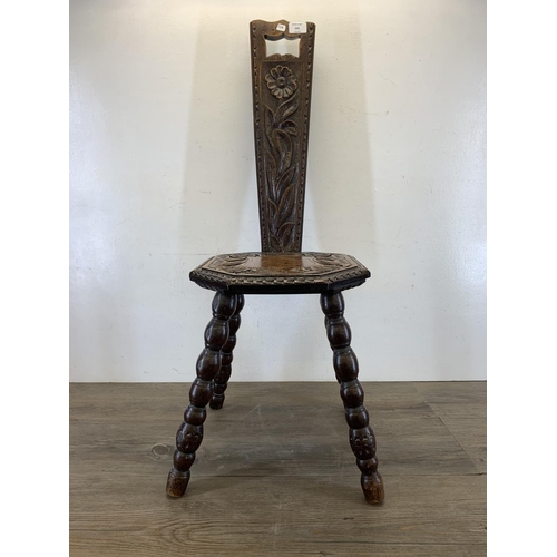 141 - A vintage carved oak spinning chair - approx. 87cm high