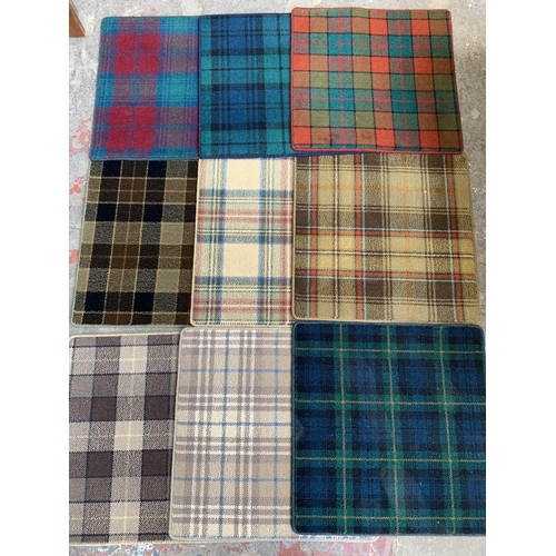 18 - A large quantity of Hugh Mackay carpet samples from The Tartan Collection - each approx. 65cm x 65cm