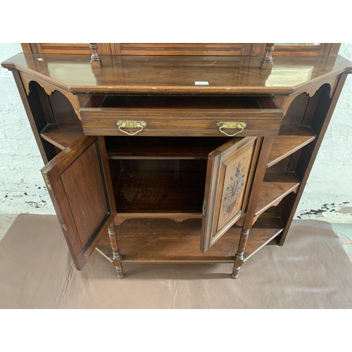 2 - An Edwardian mahogany mirrored back display cabinet with five shelves, two carved panel doors, one d... 