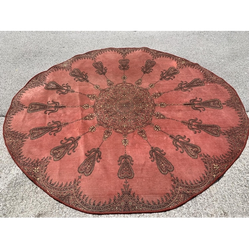 204 - A red circular rug