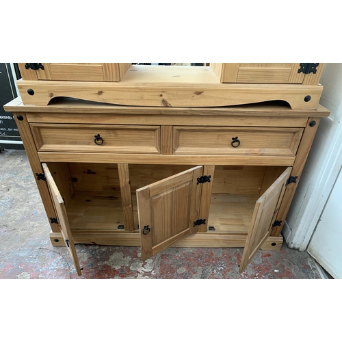 25 - Two pieces of pine furniture, one sideboard - approx. 81cm high x 132cm long x 43cm deep and one TV ... 