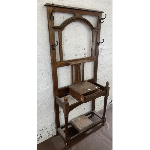 3 - An early 20th century oak hall stand - approx. 188cm high x 83cm wide x 32cm deep