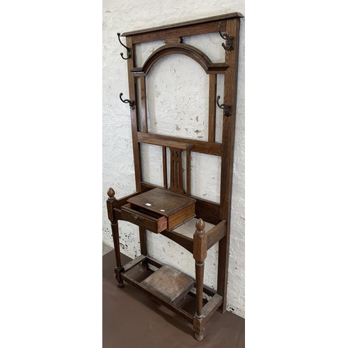 3 - An early 20th century oak hall stand - approx. 188cm high x 83cm wide x 32cm deep