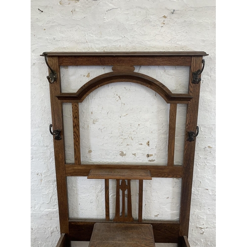 3 - An early 20th century oak hall stand - approx. 188cm high x 83cm wide x 32cm deep