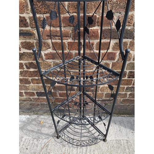 31 - A wrought iron five tier corner display stand - approx. 177cm high