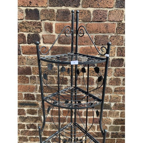 31 - A wrought iron five tier corner display stand - approx. 177cm high