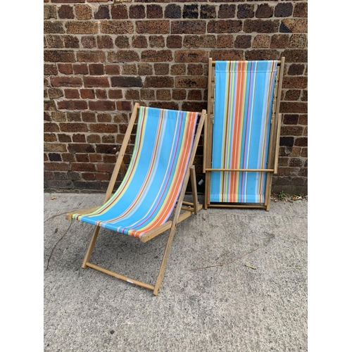 35 - A pair of mid 20th century style beech framed sun loungers