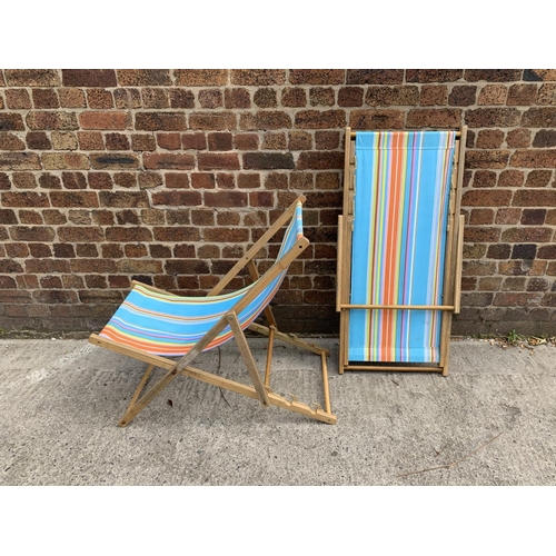 35 - A pair of mid 20th century style beech framed sun loungers