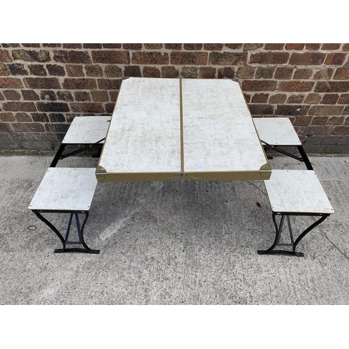 36 - A 1950s Milwaukee Stamping Co. 'Handy' folding picnic table and chair set