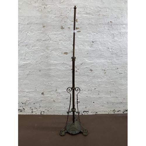 38 - An Arts & Crafts copper telescopic standard lamp on footed base - approx. 147cm high