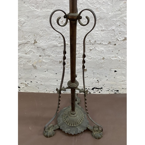 38 - An Arts & Crafts copper telescopic standard lamp on footed base - approx. 147cm high