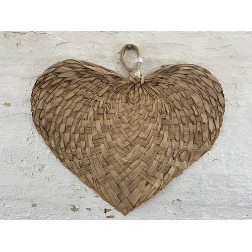 4 - A contemporary woven palm leaf heart shaped wall hanging - approx. 84cm high x 92cm wide