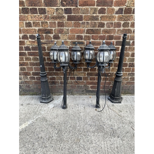 42 - A pair of Victorian style cast metal three branch garden/street lanterns - approx. 215cm high