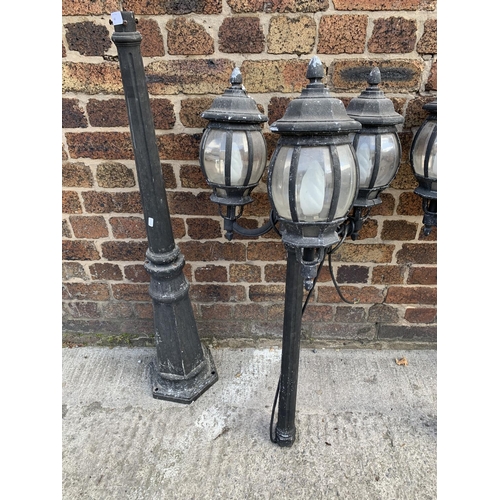 42 - A pair of Victorian style cast metal three branch garden/street lanterns - approx. 215cm high