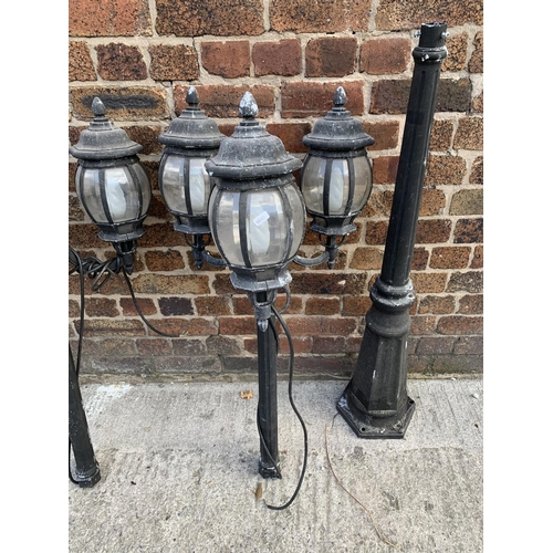 42 - A pair of Victorian style cast metal three branch garden/street lanterns - approx. 215cm high