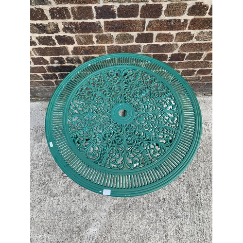 43A - A Victorian style green painted cast aluminium patio table - approx. 69cm high x 80cm in diameter