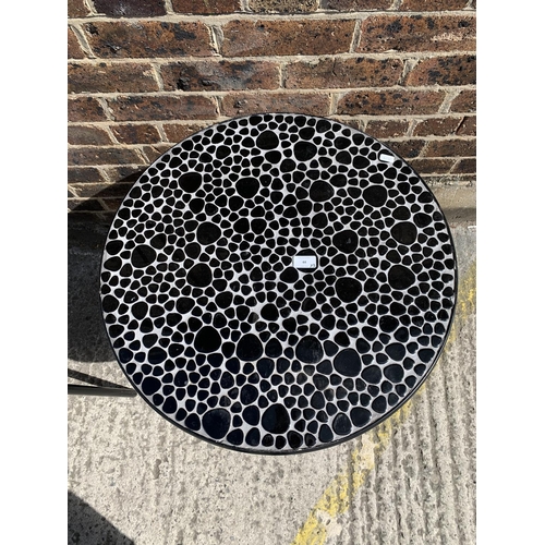 44 - A modern black metal and resin topped patio table with two chairs - table approx. 73cm high x 61cm i... 