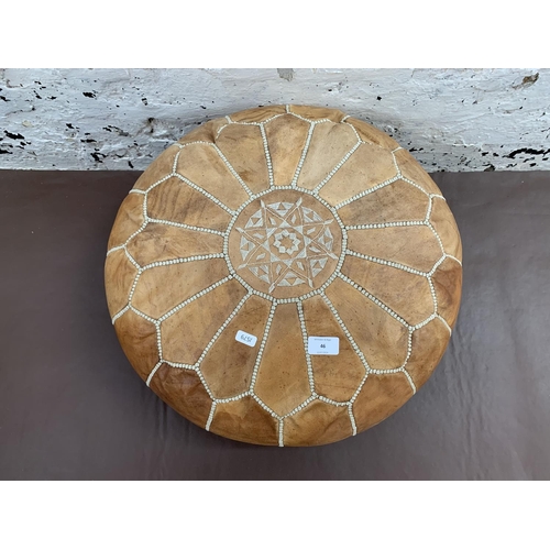 46 - A mid 20th century Moroccan tanned leather circular footstool - approx. 52cm diameter