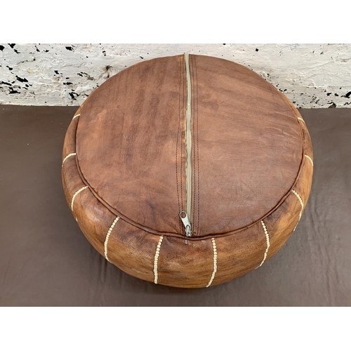 46 - A mid 20th century Moroccan tanned leather circular footstool - approx. 52cm diameter