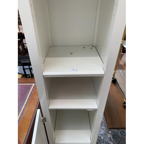 57 - Two items, one white laminate free standing bathroom cabinet - approx. 164cm high x 40cm wide x 40cm... 