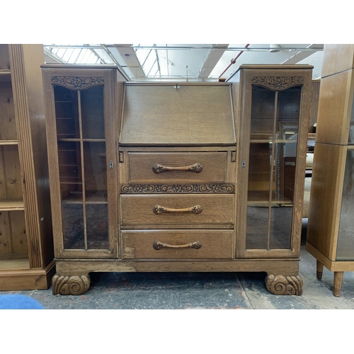 61 - An early/mid 20th century oak bureau display cabinet - approx. 110cm high x 120cm wide x 34cm deep