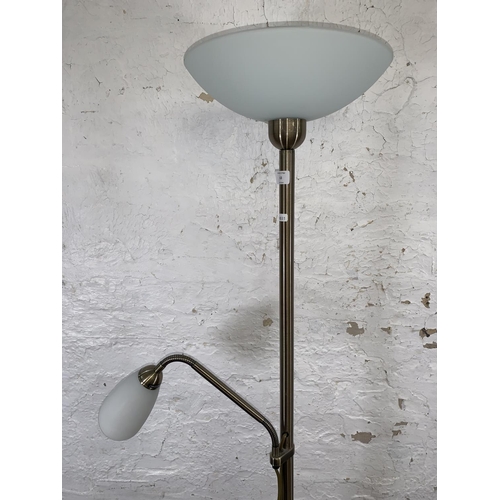 63 - A brushed brass effect uplighter and reading lamp with frosted glass shades - approx. 182cm high