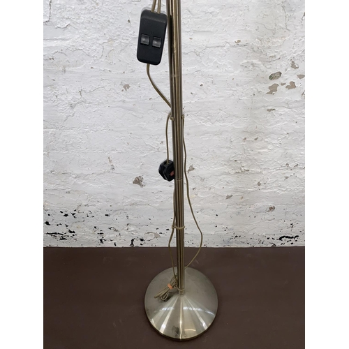 63 - A brushed brass effect uplighter and reading lamp with frosted glass shades - approx. 182cm high