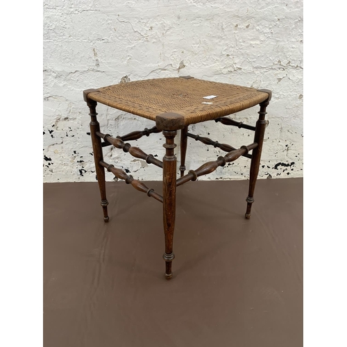 77 - An Edwardian oak and rush seated stool - approx. 41cm high x 40cm wide x 37cm deep