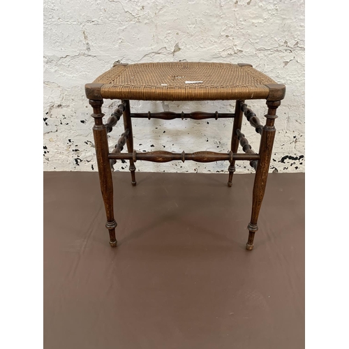 77 - An Edwardian oak and rush seated stool - approx. 41cm high x 40cm wide x 37cm deep