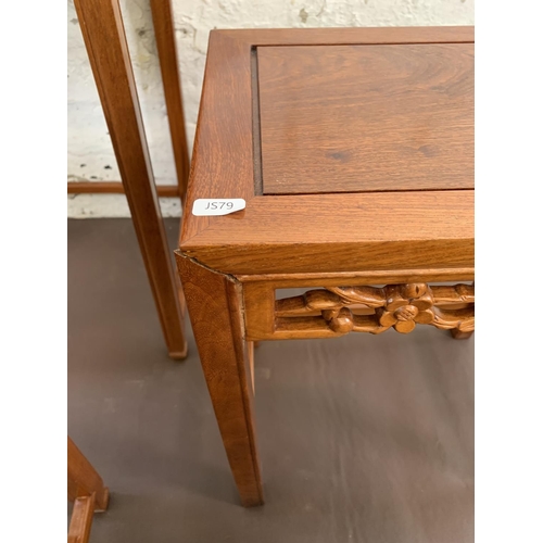 84 - A Chinese hardwood nest of four tables - largest approx. 66cm high x 50.5cm wide x 35cm deep